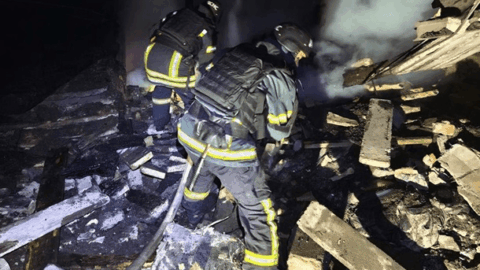 Emergency responders at Kryvyi Rih after missile strike December 2025