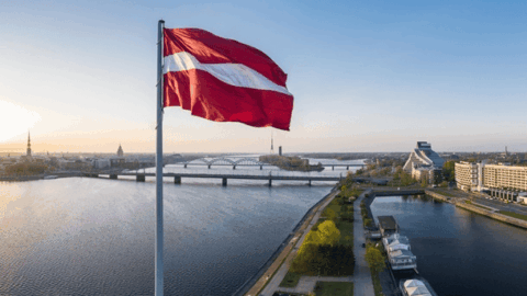 Latvia Saeima building Riga and Ukrainian refugees concept 2025