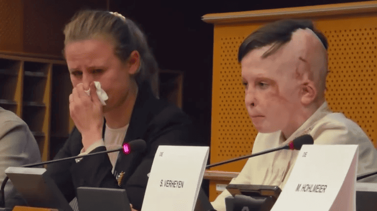 Interpreter Weeps in European Parliament While Telling 11-Year-Old Roman Oleksiv’s Story of Surviving 2022 Vinnytsia Rocket Attack