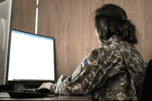 Ukraine Armed Forces personnel using digital logistics system screens in operations center, managing supplies and procurement in real time. :contentReference[oaicite:1]{index=1}