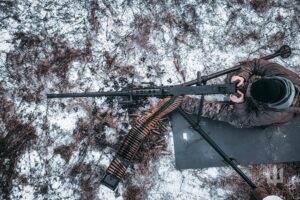 Ukrainian soldiers in winter frontline positions amid smoke and explosions during Jan 16, 2026 clashes, highlighting fierce war intensity