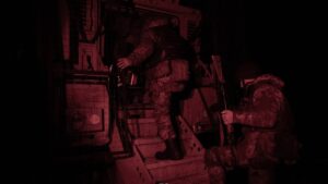 Ukrainian soldiers in winter frontline positions amid smoke and explosions during Jan 18, 2026 clashes, highlighting fierce war intensity