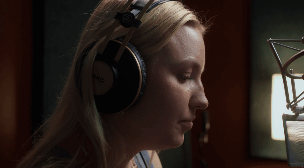Ukrainian singer Kelsie Kimberlin in studio, her music catalog removed from global streaming platforms amid Russian hybrid war allegations.