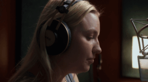 Ukrainian singer Kelsie Kimberlin in studio, her music catalog removed from global streaming platforms amid Russian hybrid war allegations.