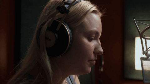 Ukrainian singer Kelsie Kimberlin in studio, her music catalog removed from global streaming platforms amid Russian hybrid war allegations.