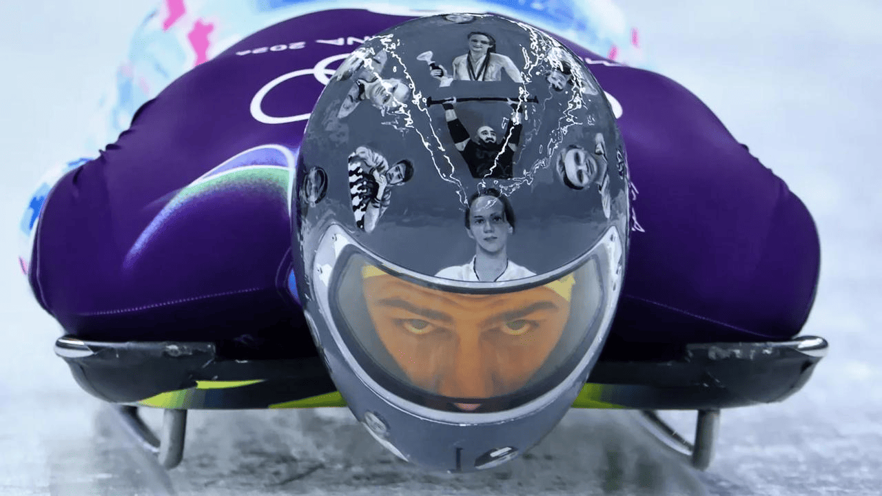 Ukrainian skeleton racer Vladyslav Heraskevych in Milano Cortina 2026 gear, custom helmet honoring war-victims, amid IOC ban and controversy
