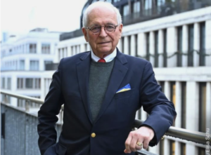 Wolfgang Ischinger speaking at the Munich Security Conference, symbolizing Europe’s controversial stance on a ceasefire in Ukraine.