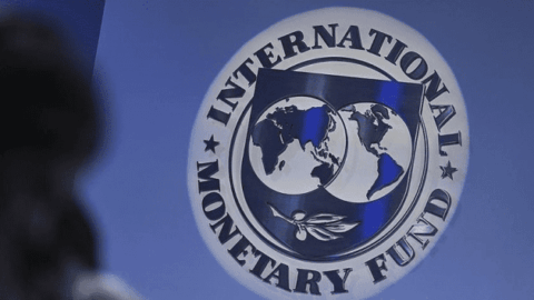 Stack of IMF currency notes and financial documents representing Ukraine’s receipt of its first $1.5B tranche under a new IMF program