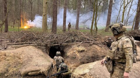 Explosions over Ukrainian city skyline with air‑raid defenses and frontline troops in action during the March 13 2026 Russia‑Ukraine war updates.