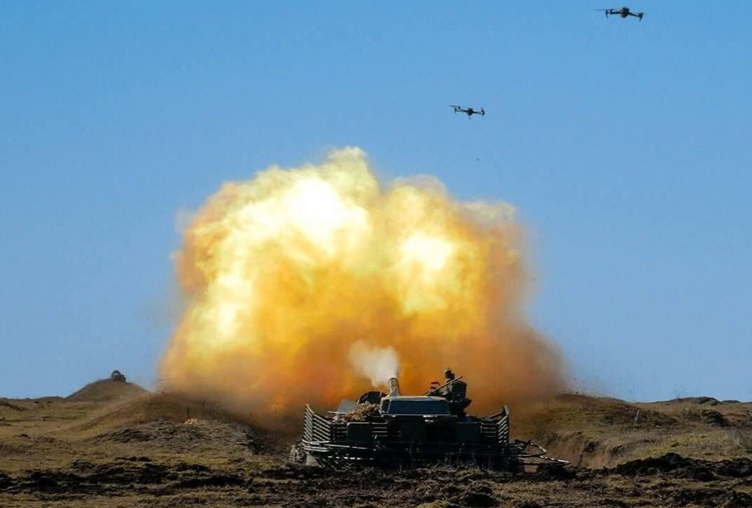 Fierce frontline combat scene with drones and missile impacts during Russia‑Ukraine war on March 18 2026 as forces clash and air defenses engage.