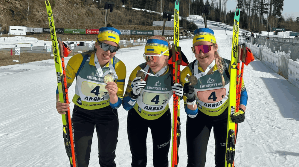 Ukrainian junior biathletes celebrating medals at the 2026 Junior World Championships in Germany after winning six podium finishes.