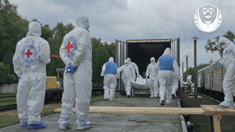 Repatriation of fallen Ukrainian soldiers with coordinated transport and forensic teams handling remains for identification process