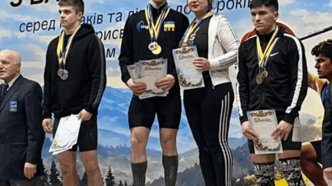 Ukrainian U17 weightlifting champion Mark Hvizdon performing clean and jerk during national championship in Kolomyia