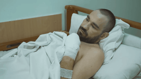 Wounded Ukrainian paratrooper in frontline trench after holding position alone for two months under constant combat conditions