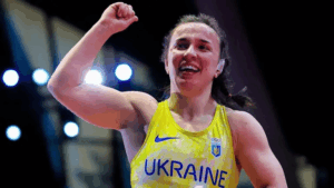 Ukrainian athlete on podium during European Championship as national anthem plays after victory over Russian competitor