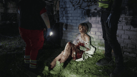 Kyiv resident sitting near a damaged home after Russian strike captured in award-winning World Press Photo 2026 image by Yevhen Maloletka
