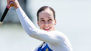 Liudmyla Luzan celebrating four gold medals during international canoe sprint competition