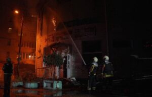 Aftermath of Russian ballistic missile strike on Kyiv with damaged buildings and fires