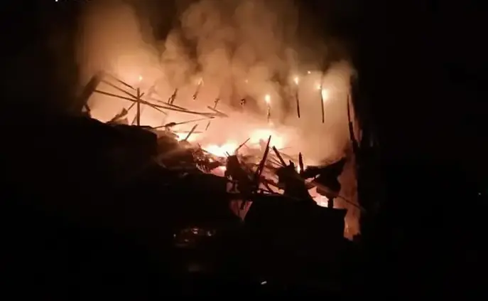 Aftermath of the Russian missile and drone attack on Ukraine’s Kyiv region, with emergency responders at a damaged site